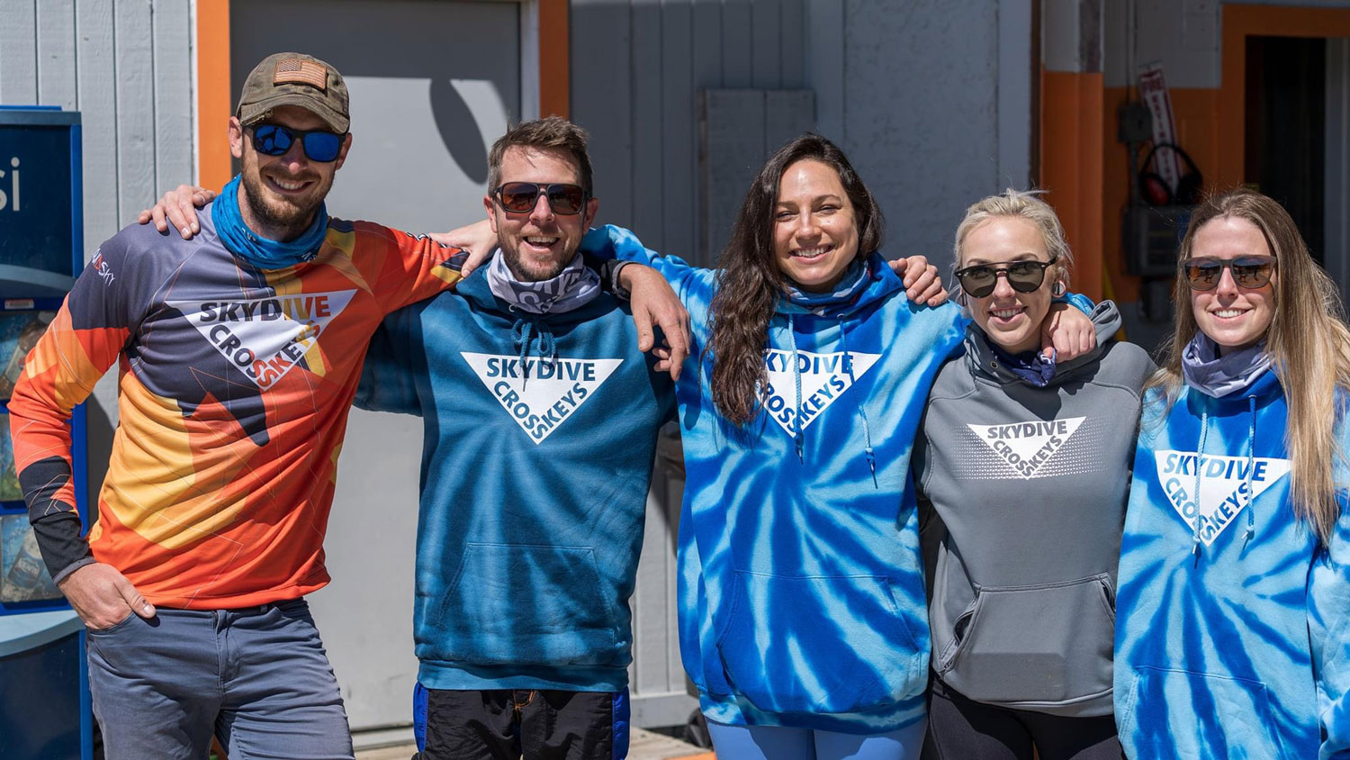 Professional skydiving team smiling at the dropzone.